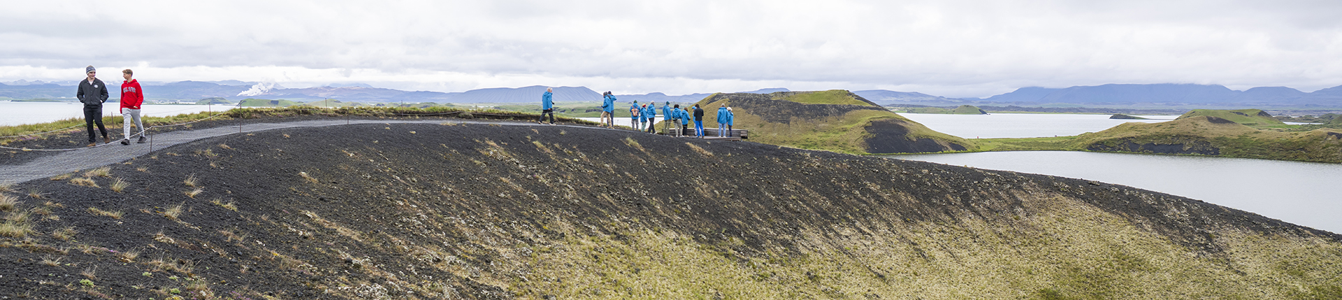 Group of people walking along a path in Iceland