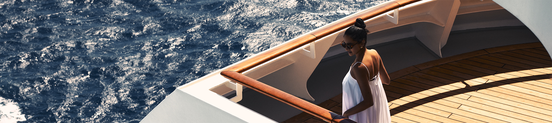 Woman on board a Crystal ship at sea during daytime