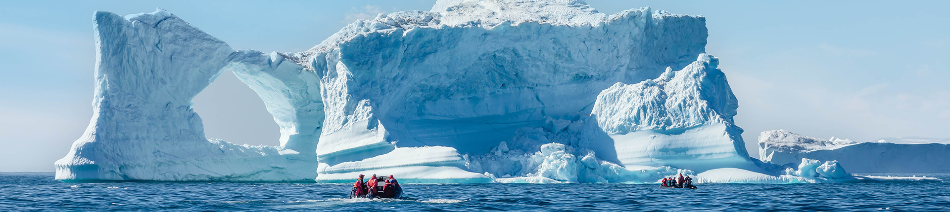 Guests explore by zodiac amongst icebergs in Greenland